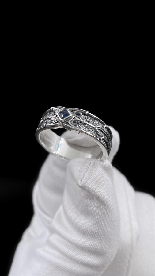 A men’s gothic fantasy ring with a textured darkened surface, silver sculpted lines, and a blood-red center stone. This ring offers a bold mix of elegance and strength, perfect for fans of dark artistry, role-play fashion, or medieval-inspired jewelry. Its sturdy build and eye-catching design make it a meaningful gift for special occasions. __etsy:7131752773