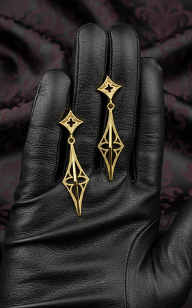 The Stiletto earrings are reimagined in 14k Rose Gold. The transformation turns the "Silver Spike" into a "Golden Ray." The warm metal softens the aggression of the shape, making it look like a sunbeam or a stylized flame. This version feels luxurious and radiant, perfect for a high-fashion look that commands attention without being dark. (etsy image id: 7217878836)