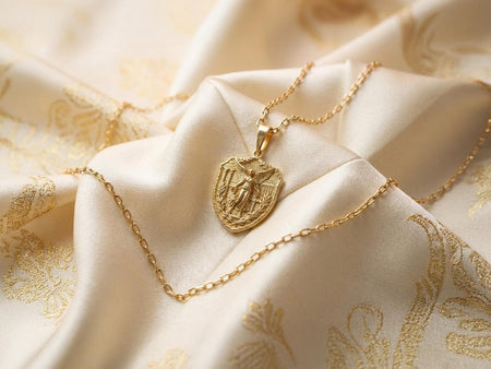 Reimagined in solid 14k yellow gold, this classical Nike goddess pendant transforms from a brooding stone relic into a radiant, museum-quality treasure. The warm gold illuminates the intricate wings, laurel wreath, and temple columns, giving the architectural relief an opulent, regal glow reminiscent of precious ancient Greek coinage. The brushed matte finish elevates this historical motif into a luxurious fine jewelry masterpiece. __etsy:8003064650
