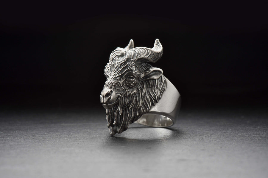 Embrace the mystique and strength of the goat with this handcrafted sterling silver goat ring. Designed for those who appreciate wild nature, Norse symbolism, and bold statement jewelry, this ring captures the essence of independence, intelligence, and resilience.

The intricately detailed goat head design makes this ring perfect for animal lovers, Viking enthusiasts, and those drawn to occult or pagan aesthetics. __etsy:4047309436