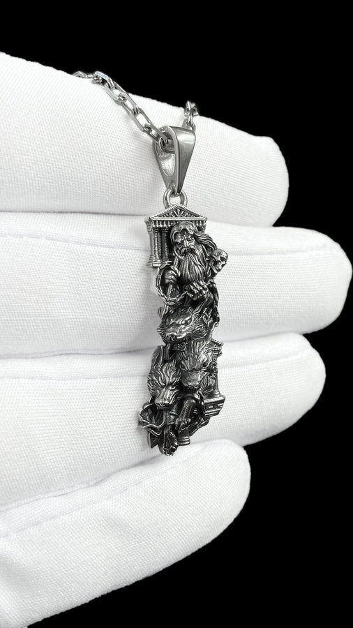 Crafted from premium solid sterling silver, this heavy, sculptural pendant demonstrates the striking visual impact of an oxidized patina. The dark sulfur treatment settles heavily into the microscopic crevices of the temple steps, the eagle's feathers, and Zeus's beard, providing a permanent shadow that makes the polished, raised metal elements shine brilliantly. A polished silver tapered bail connects the piece to a sturdy geometric chai __etsy:8113663105
