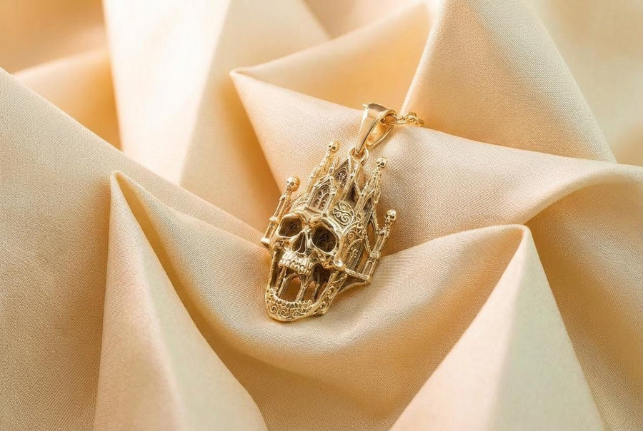 A close-up studio photograph of a highly detailed sterling silver pendant hanging from a sturdy chain against a black background. The striking design seamlessly merges the lower half of a fanged human skull with the upper structure of a Gothic cathedral. The architecture features soaring spires, pointed lancet arches, and intricate openwork tracery, with tiny skulls resting atop the outer pillars. __etsy:8027326873