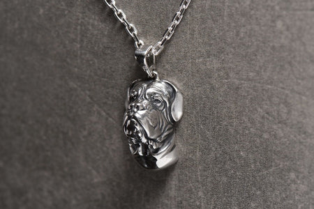 Made from high-quality silver, this pendant features intricate details that capture the essence of the beloved bulldog breed. Its sleek and modern design makes it versatile enough to wear with any outfit, from casual to formal.