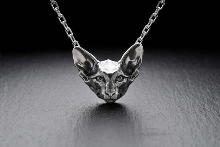 Crafted with meticulous attention to detail, the pendant showcases the unique features of the Oriental cat, including its distinctive face shape and long, graceful body.