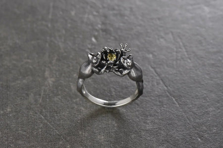 Our Sterling Silver Ring "Frogs" are not only visually appealing, but they also hold symbolic significance. Frogs are often associated with transformation, good luck, and abundance.