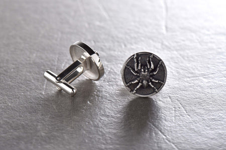 The attention to detail is remarkable, with every curve and line of the spider's features expertly crafted. These cufflinks are both durable and comfortable to wear, making them the perfect addition to your collection.