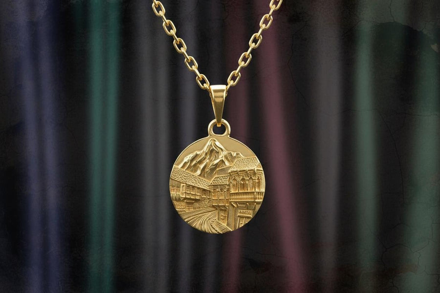 This beautiful pendant is the perfect souvenir to remember your trip to the beautiful city of Tbilisi. It features a detailed, hand-crafted design of the skyline of Tbilisi, Georgia.