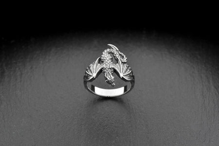 Dragon lovers, this is the ring for you! This ring is made of high quality silver, and it's perfect for those who love dragons.
It's looks like a dragon from ancient legends. (etsy image id: 4202918286)