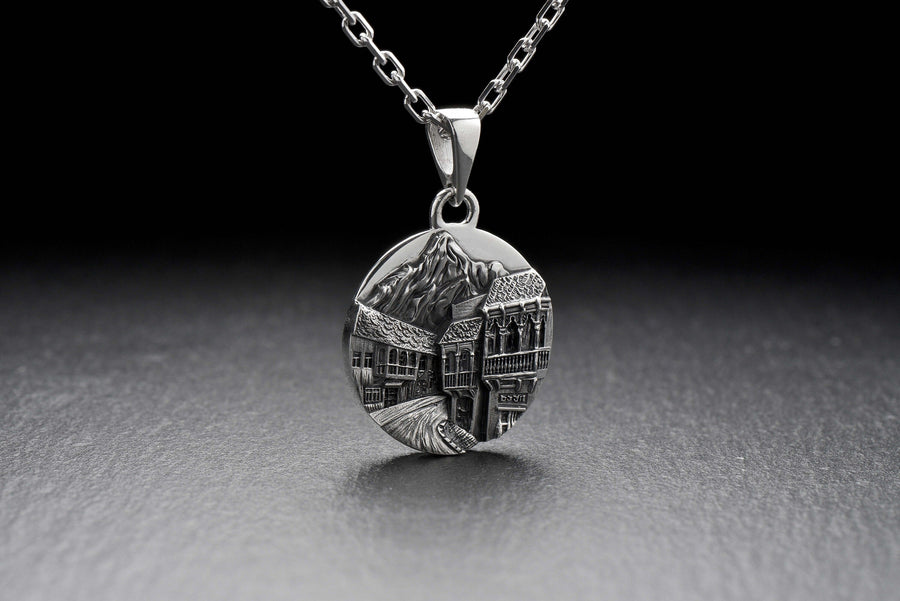 This beautiful pendant is the perfect souvenir to remember your trip to the beautiful city of Tbilisi. It features a detailed, hand-crafted design of the skyline of Tbilisi, Georgia.