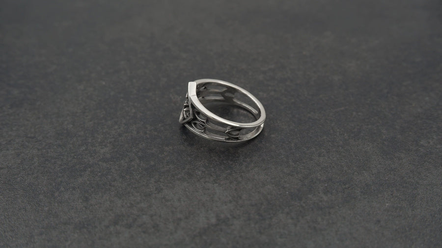 Detailed view of the ring's texture, showing the stippled, hammered finish inside the recessed arches. This "granulation" effect adds a raw, artisan quality to the piece, distinguishing it from mass-produced jewelry. The 925 sterling silver has been treated with sulfur to achieve a permanent dark patina in the low points, ensuring the architectural pattern remains visible even with daily wear. The metal looks solid and durable, suit (etsy image id: 6980758746)