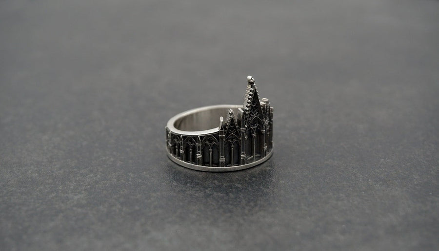 We have rings for people who love to explore the great outdoors, as well as those who love to stay in. With memories and kindness. The image highlights the "chiselled" quality of the 925 sterling silver. The ridges of the rooflines and pillars are sharp and defined, while the background surfaces have a textured, grainy finish like limestone. The oxidation is applied carefully to the "windows" and "doors" of the cathe (etsy image id: 4211827296)