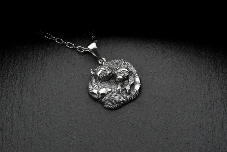 The pendant is made of high quality silver, which guarantees its durability and resistance to damage. Its unique adorable raccoon design is eye-catching and adds a pop of color to any look. (etsy image id: 6100406265)