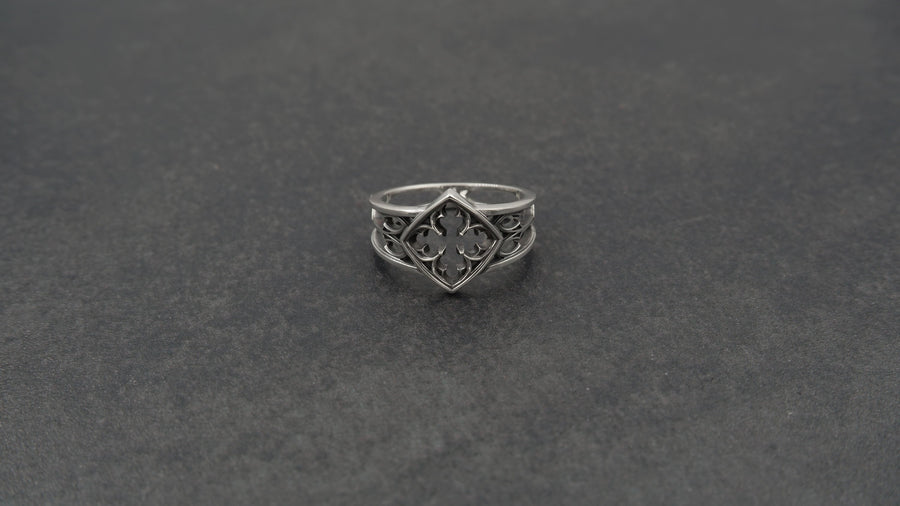 Detailed view of the ring's texture, showing the stippled, hammered finish inside the recessed arches. This "granulation" effect adds a raw, artisan quality to the piece, distinguishing it from mass-produced jewelry. The 925 sterling silver has been treated with sulfur to achieve a permanent dark patina in the low points, ensuring the architectural pattern remains visible even with daily wear. The metal looks solid and durable, suit (etsy image id: 6980758746)