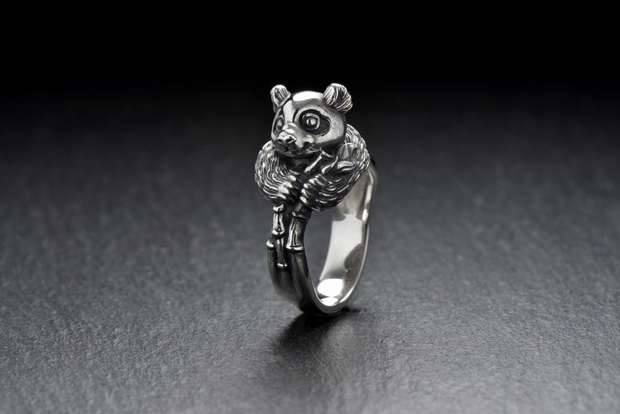 Celebrate the gentle charm of pandas with this beautifully crafted sterling silver panda ring. Designed with intricate detail, this ring captures the playful and endearing spirit of one of nature's most beloved creatures. (etsy image id: 6483013394)
