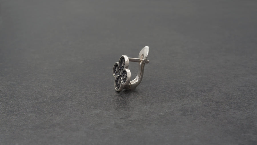 With their timeless beauty and one-of-a-kind design, these earrings are a must-have accessory for anyone who wants to stand out from the crowd. Don't miss this opportunity to own a piece of gothic elegance, order now! The image highlights the contrast between the two sections. The stud features a dense, "micro-relief" pattern that looks like chainmail or textile. The drop is smooth and linear, providing a visual break. (etsy image id: 7090850125)
