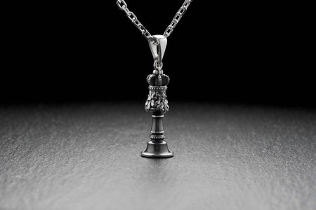 Silver pendant depicting a chess piece of the King. This pendant is crafted from high quality sterling silver and has stunning detailing. (etsy image id: 4596442956)