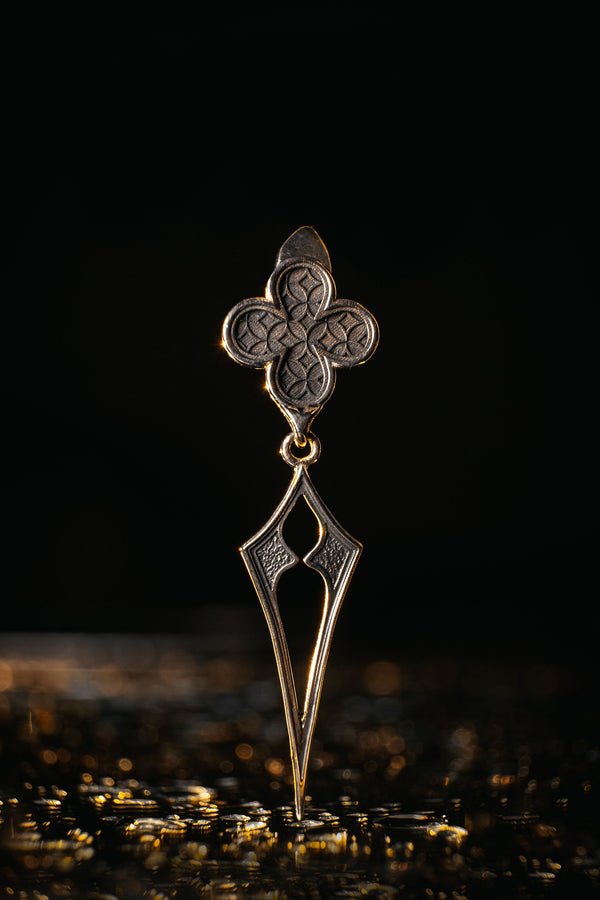 With their timeless beauty and one-of-a-kind design, these earrings are a must-have accessory for anyone who wants to stand out from the crowd. Don't miss this opportunity to own a piece of gothic elegance, order now! The image highlights the contrast between the two sections. The stud features a dense, "micro-relief" pattern that looks like chainmail or textile. The drop is smooth and linear, providing a visual break. (etsy image id: 7090850125)