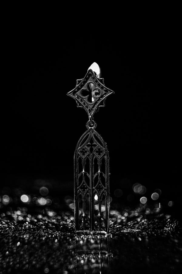 The image focuses on the interplay of light and shadow on the 925 sterling silver. The ridges of the arches are polished to a high shine, while the inner recesses are blackened with oxidation. This technique gives the earrings the visual weight of stone masonry while maintaining the lightness required for a comfortable ear dangle. (etsy image id: 7218591328)