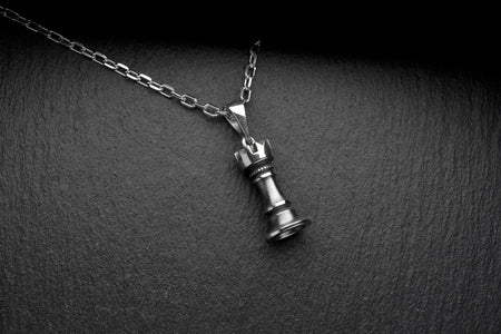 Whether you're a chess enthusiast or simply looking for a unique and stylish accessory, this silver pendant with the chess figure Rook is the perfect addition to your collection.  Elevate your style today with this stunning piece of jewelry! (etsy image id: 4652585576)