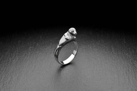 Whether you're dressing up for a special occasion or adding a touch of personality to your everyday style, this Seal Silver Ring is the perfect choice. (etsy image id: 4679041125)