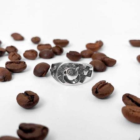 Looking for a unique accessory that celebrates your love for coffee? Check out our stunning silver ring that will make you want to sip your favorite brew all day long! (etsy image id: 4738658083)