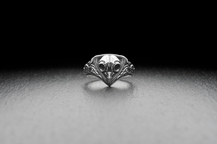 Embrace the mysteries of the night with our Sterling Silver Ring Owl Skull. This hauntingly beautiful piece is a tribute to the enigmatic and elusive spirit of the owl, a creature revered by many cultures for its wisdom and intuition. (etsy image id: 6981604606)
