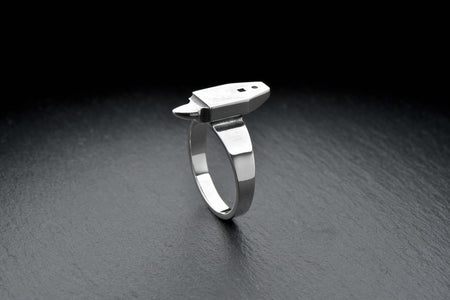Crafted with attention to detail, this ring features a realistic anvil design on the band. The anvil symbolizes strength, resilience, and the dedication required to create something remarkable. (etsy image id: 4996068010)