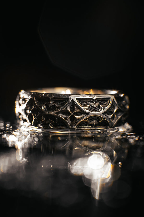 Bathed in soft, romantic light against elegant white silk, this alternative bridal set perfectly balances dark gothic architecture with traditional wedding luxury. The rings evoke a mysterious, dark academia atmosphere, capturing the timeless beauty of ancient stone cathedrals and eternal devotion. Designed for modern couples who appreciate history and non-traditional aesthetics, this matching wedding set is a profound symbol of a love story root (etsy image id: 7928015292)