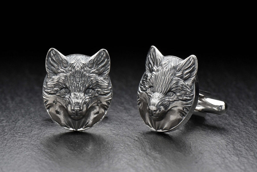 May include: A pair of silver fox head cufflinks. The cufflinks are round and feature a detailed fox head design. (etsy image id: 7689621560)