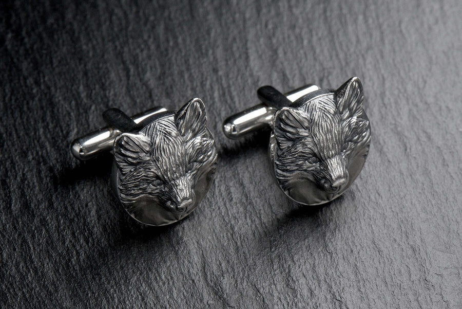 May include: A pair of silver fox head cufflinks. The cufflinks are round and feature a detailed fox head design. (etsy image id: 7689621560)