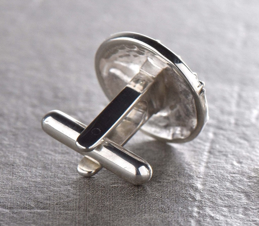 May include: A pair of silver cufflinks featuring a detailed dragon head design. (etsy image id: 7689558200)