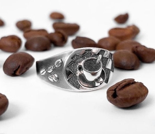 Looking for a unique accessory that celebrates your love for coffee? Check out our stunning silver ring that will make you want to sip your favorite brew all day long! (etsy image id: 4738658083)