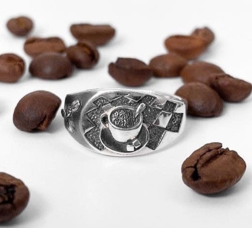 Looking for a unique accessory that celebrates your love for coffee? Check out our stunning silver ring that will make you want to sip your favorite brew all day long! (etsy image id: 4738658083)
