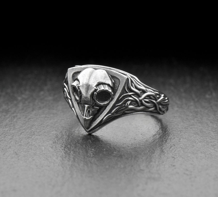 Embrace the mysteries of the night with our Sterling Silver Ring Owl Skull. This hauntingly beautiful piece is a tribute to the enigmatic and elusive spirit of the owl, a creature revered by many cultures for its wisdom and intuition. (etsy image id: 6981604606)