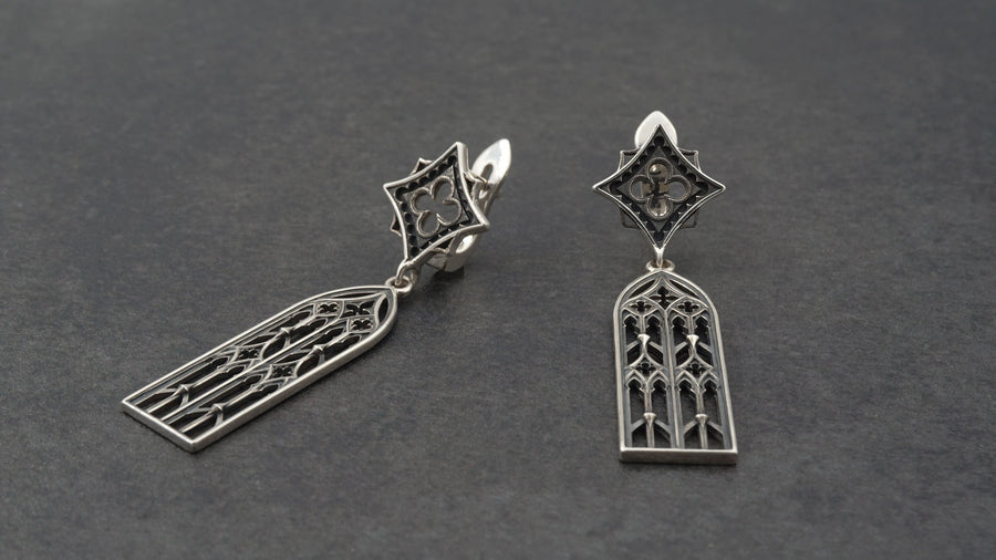 The image focuses on the interplay of light and shadow on the 925 sterling silver. The ridges of the arches are polished to a high shine, while the inner recesses are blackened with oxidation. This technique gives the earrings the visual weight of stone masonry while maintaining the lightness required for a comfortable ear dangle. (etsy image id: 7218591328)