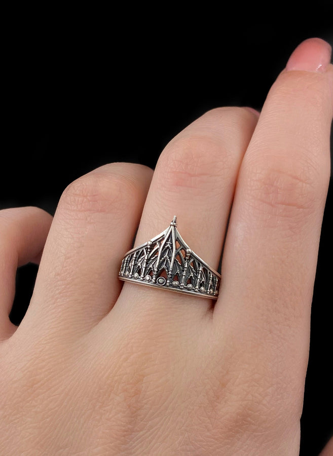 The spire represents the connection between the earth and the heavens, or high aspirations. The ribbed vaulting represents strength through structure. Wearing this ring as a "crown" on the finger symbolizes personal sovereignty and a dedication to higher ideals. It is a piece that commands respect. (etsy image id: 7976017075)
