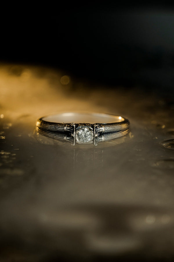 This sterling silver ring set features bold architectural column details with finely carved fluting and ornate capital motifs. The design draws inspiration from ancient Greek and Roman structures, offering a sculptural aesthetic that feels elegant and timeless. Ideal for wedding sets or collectors of detailed art jewelry, the polished silver contrasts beautifully with the deep engraved textures.