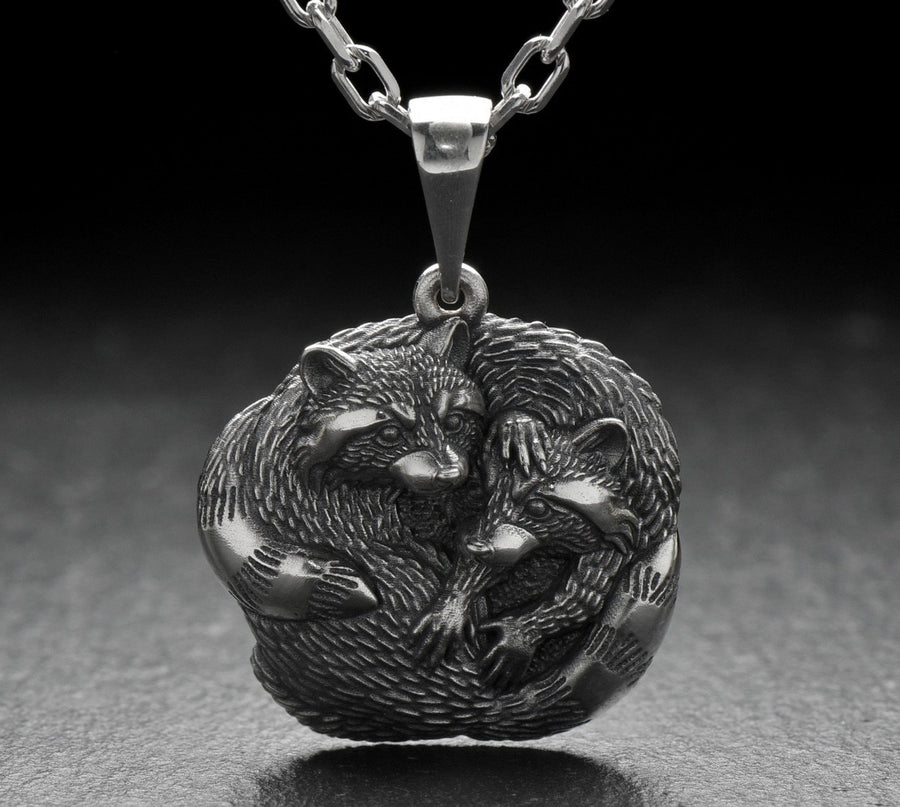 The pendant is made of high quality silver, which guarantees its durability and resistance to damage. Its unique adorable raccoon design is eye-catching and adds a pop of color to any look. (etsy image id: 6100406265)