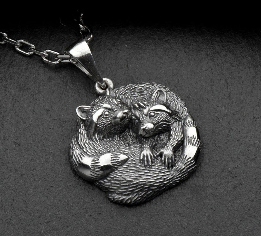 The pendant is made of high quality silver, which guarantees its durability and resistance to damage. Its unique adorable raccoon design is eye-catching and adds a pop of color to any look. (etsy image id: 6100406265)
