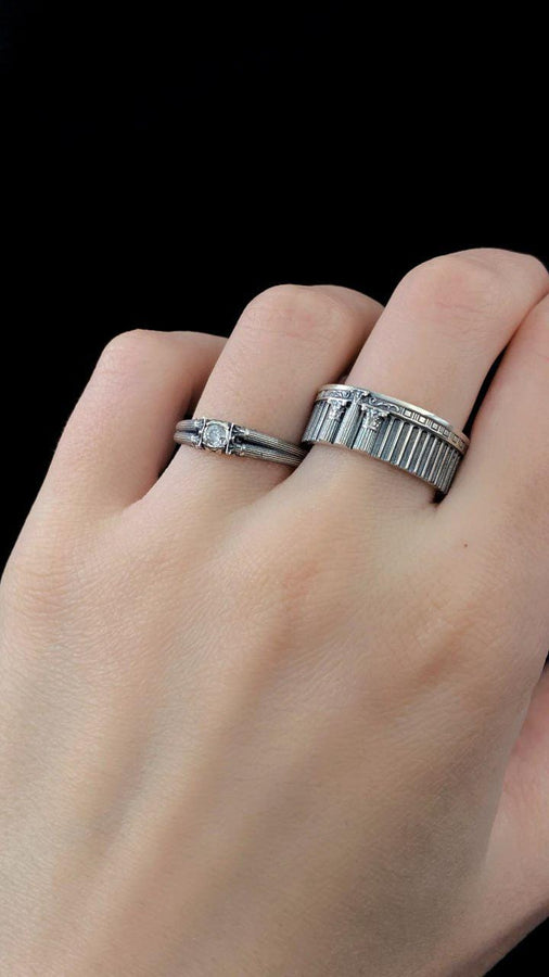 A handcrafted sterling silver ring inspired by ancient Greek architecture, featuring vertical column grooves and a raised stone bezel. The Art Deco influence enhances the structured design, giving it a refined yet historical appearance. Excellent for proposal moments, themed weddings, or collectors who love architectural motifs in fine jewelry. (etsy image id: 6163725531)