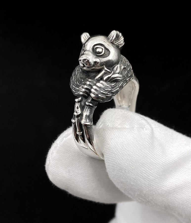 Celebrate the gentle charm of pandas with this beautifully crafted sterling silver panda ring. Designed with intricate detail, this ring captures the playful and endearing spirit of one of nature's most beloved creatures. (etsy image id: 6483013394)