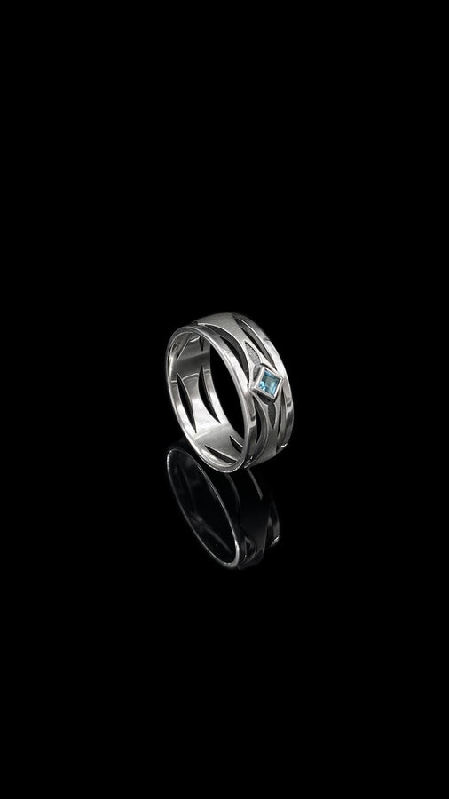 Mysterious and enchanting, this gothic silver ring is handcrafted with delicate detailing and a gemstone that adds a striking contrast to its intricate design.
A dramatic sterling silver ring with a central square blue gem, surrounded by carved details reminiscent of gothic architecture. Ideal for wearers seeking distinctive jewelry that stands apart from classic designs. (etsy image id: 7283442213)