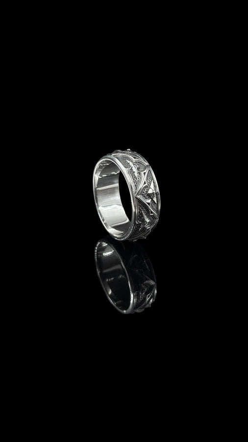 Detailed view of the ring's texture, showing the stippled, hammered finish inside the recessed arches. This "granulation" effect adds a raw, artisan quality to the piece, distinguishing it from mass-produced jewelry. The 925 sterling silver has been treated with sulfur to achieve a permanent dark patina in the low points, ensuring the architectural pattern remains visible even with daily wear. The metal looks solid and durable, suit (etsy image id: 7305774839)