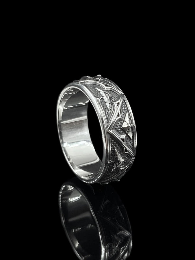 Detailed view of the ring's texture, showing the stippled, hammered finish inside the recessed arches. This "granulation" effect adds a raw, artisan quality to the piece, distinguishing it from mass-produced jewelry. The 925 sterling silver has been treated with sulfur to achieve a permanent dark patina in the low points, ensuring the architectural pattern remains visible even with daily wear. The metal looks solid and durable, suit (etsy image id: 7305774839)