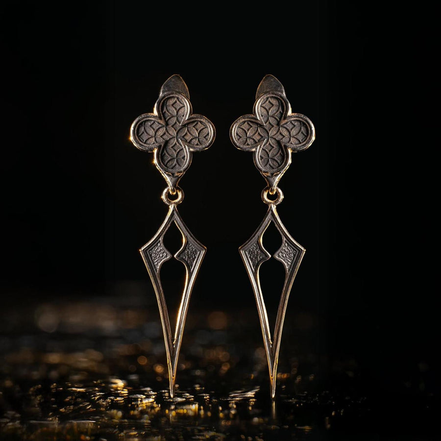 With their timeless beauty and one-of-a-kind design, these earrings are a must-have accessory for anyone who wants to stand out from the crowd. Don't miss this opportunity to own a piece of gothic elegance, order now! The image highlights the contrast between the two sections. The stud features a dense, "micro-relief" pattern that looks like chainmail or textile. The drop is smooth and linear, providing a visual break. (etsy image id: 7090850125)