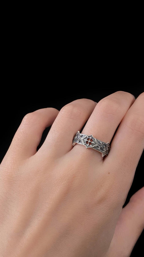 Handmade sterling silver band with an intricate gothic crown motif in the center, framed by swirling ornamental engravings. The deep relief and antique darkened finish evoke historic cathedral carvings. Ideal for customers seeking dark romantic jewelry, gothic accessories, medieval wedding rings, and meaningful silver bands with symbolic architecture-inspired designs. (etsy image id: 7423455351)