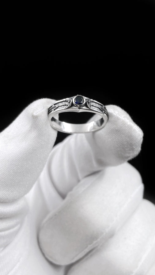This gothic sterling silver ring features a vivid red garnet set in a detailed medieval-inspired band with darkened textures and graceful, pointed motifs. Designed for lovers of fantasy, gothic fashion, and artisan jewelry, it offers an elegant yet dramatic look. Perfect as a unique wedding band, engagement ring, or statement piece for anyone drawn to symbolic and timeless gothic style. (etsy image id: 7425901470)