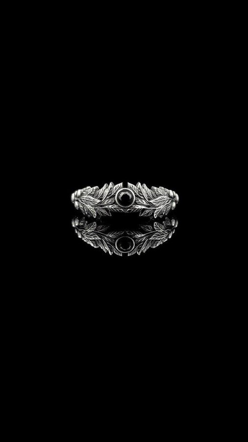 Crafted with care, this gothic silver ring with its vintage charm and gemstone centerpiece will add a touch of dark elegance to any occasion, making it a perfect gift. (etsy image id: 7463722171)