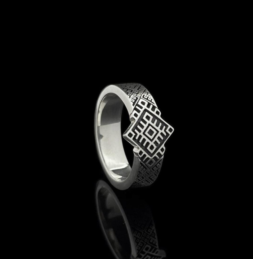 This close-up demonstrates the "relief" texture of the ring. The pattern is not merely etched but deeply cast, with significant height difference between the silver lines and the black background. The 925 sterling silver is substantial and thick. The oxidation is uniform and matte, designed to withstand daily wear without fading, creating a permanent "shadow" that defines the intricate geometry. (etsy image id: 7206997519)