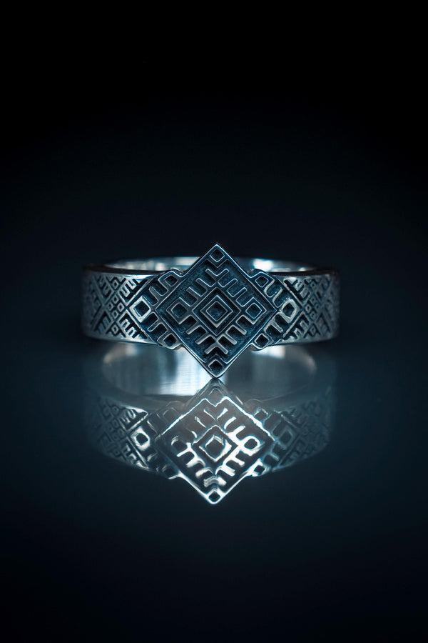 This close-up demonstrates the "relief" texture of the ring. The pattern is not merely etched but deeply cast, with significant height difference between the silver lines and the black background. The 925 sterling silver is substantial and thick. The oxidation is uniform and matte, designed to withstand daily wear without fading, creating a permanent "shadow" that defines the intricate geometry. (etsy image id: 7206997519)